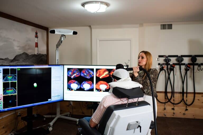 A TMS Doctor using fMRI on a Patient