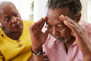 Senior woman comforting man