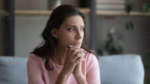 Sad woman sitting on a couch