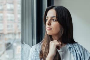 Woman looking out a window