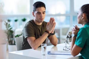 Young soldier talking to therapist