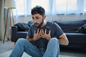 Man having a panic attack on the floor