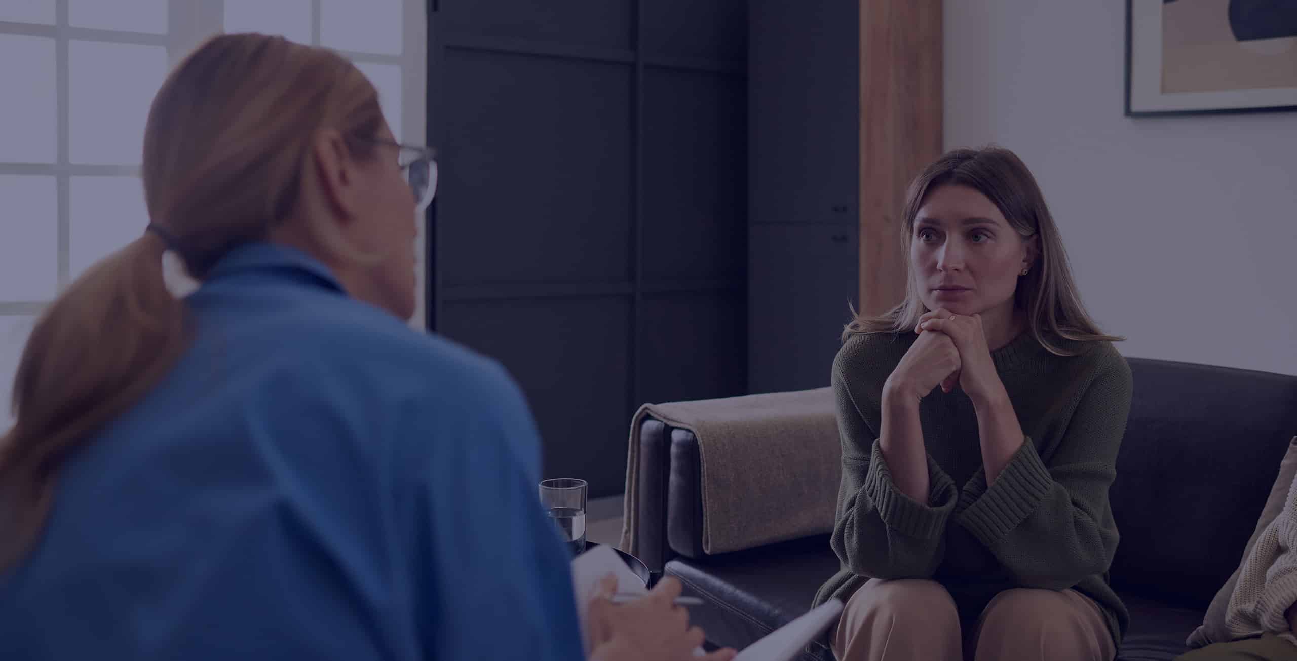 Psychologist in an appointment with a depressed patient.